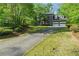 Charming two-story brick home with lush landscaping and a two-car garage at 1550 Pine Creek Way, Woodstock, GA 30188