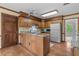 Traditional kitchen featuring wood cabinets, granite counters and white appliances at 1550 Pine Creek Way, Woodstock, GA 30188
