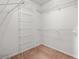 Walk-in closet with wire shelving on carpeted flooring at 1550 Pine Creek Way, Woodstock, GA 30188