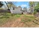 Expansive backyard with a well-maintained lawn, wooden fence, and view of the modern home's rear facade at 2870 Ridgemore Nw Rd, Atlanta, GA 30318
