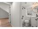 Charming bathroom showcasing black and white floors, modern fixtures, and a window with natural light at 2870 Ridgemore Nw Rd, Atlanta, GA 30318