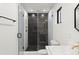 Updated bathroom featuring black tiled shower and gold fixtures at 2870 Ridgemore Nw Rd, Atlanta, GA 30318