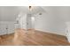 Large bedroom showcasing neutral decor, hardwood floors, and nearby ensuite bathroom at 2870 Ridgemore Nw Rd, Atlanta, GA 30318