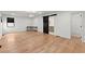 Large bedroom featuring hardwood floors, black barn door, and modern chandelier at 2870 Ridgemore Nw Rd, Atlanta, GA 30318