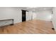 Expansive bedroom with wood floors, black barn door and access to the bathroom and closets at 2870 Ridgemore Nw Rd, Atlanta, GA 30318