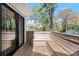 Inviting wooden deck featuring built-in bench seating, perfect for outdoor relaxation and enjoying the surrounding natural beauty at 2870 Ridgemore Nw Rd, Atlanta, GA 30318