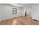 Bright dining area with hardwood floors, a modern chandelier, and a view into the stylish kitchen, creating an inviting space at 2870 Ridgemore Nw Rd, Atlanta, GA 30318