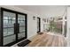 Covered front porch with wooden flooring, black railings and white brick at 2870 Ridgemore Nw Rd, Atlanta, GA 30318