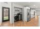 Laundry area with stainless steel washer, dryer, refrigerator and exterior entry at 2870 Ridgemore Nw Rd, Atlanta, GA 30318