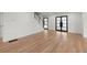 Large living room featuring hardwood floors, shiplap accent walls, and black trim at 2870 Ridgemore Nw Rd, Atlanta, GA 30318