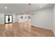 Open-concept living area with hardwood floors, ample natural light, and a modern chandelier, offering a spacious and airy ambiance at 2870 Ridgemore Nw Rd, Atlanta, GA 30318