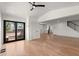Spacious living area with hardwood floors, glass doors to the deck, and a glimpse into the modern kitchen, creating an open feel at 2870 Ridgemore Nw Rd, Atlanta, GA 30318