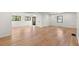 Bright, open living area with gleaming hardwood floors and abundant natural light from large windows, creating a welcoming atmosphere at 2870 Ridgemore Nw Rd, Atlanta, GA 30318