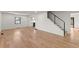 Spacious living room with wood floors, modern accents, and staircase at 2870 Ridgemore Nw Rd, Atlanta, GA 30318