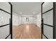 Bright living room with hardwood floors and views into the kitchen at 2870 Ridgemore Nw Rd, Atlanta, GA 30318
