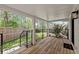 Covered back porch with wooden flooring and views of the backyard at 2870 Ridgemore Nw Rd, Atlanta, GA 30318