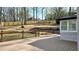 Back deck with wrought iron railing overlooking the large backyard and custom landscaping at 1960 Calvin Dr, Duluth, GA 30097