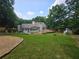Expansive backyard view with a spacious deck and lush lawn, creating an inviting outdoor oasis at 1960 Calvin Dr, Duluth, GA 30097