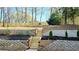 Multi-tiered backyard with stone retaining walls, steps, and new plantings at 1960 Calvin Dr, Duluth, GA 30097