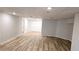 Finished basement with wood-look flooring, recessed lighting and a closet for ample storage at 1960 Calvin Dr, Duluth, GA 30097