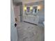 Luxurious bathroom featuring double sink vanity with framed LED mirrors and large soaking tub at 1960 Calvin Dr, Duluth, GA 30097