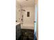 Modern bathroom with a shower-tub combination, black hardware and marble styled tiles at 1960 Calvin Dr, Duluth, GA 30097