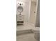 Bright bathroom featuring white tile flooring, a white vanity, a modern faucet, and a shower at 1960 Calvin Dr, Duluth, GA 30097