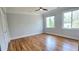 Bright bedroom with hardwood floors and two large windows offering lots of natural light at 1960 Calvin Dr, Duluth, GA 30097