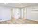 Open bedroom with wood flooring, white walls, white doors, recessed lighting, and a built-in bookshelf at 1960 Calvin Dr, Duluth, GA 30097