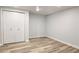 Clean bedroom with wood look flooring, and a double closet offering ample storage at 1960 Calvin Dr, Duluth, GA 30097