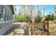Large wooden deck with dark wood railings and views of the lush backyard at 1960 Calvin Dr, Duluth, GA 30097