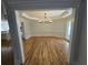Large dining room with hardwood floors and modern chandelier at 1960 Calvin Dr, Duluth, GA 30097