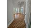 Inviting entryway with hardwood floors, white trim, and a decorative glass front door at 1960 Calvin Dr, Duluth, GA 30097