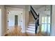 Foyer with a stairway leading to an open living space and vaulted ceiling at 1960 Calvin Dr, Duluth, GA 30097