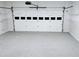 Well lit garage with epoxy floors and an automatic garage door at 1960 Calvin Dr, Duluth, GA 30097