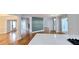 Open-concept kitchen with quartz countertops, stainless steel appliances, and hardwood floors at 1960 Calvin Dr, Duluth, GA 30097