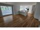 Open floor plan with modern kitchen, island cooktop, and stainless steel appliances at 1960 Calvin Dr, Duluth, GA 30097