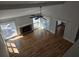 Bright living room featuring a brick fireplace and a ceiling fan with access to balcony at 1960 Calvin Dr, Duluth, GA 30097