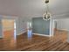 Spacious living room with hardwood floors and modern light fixture at 1960 Calvin Dr, Duluth, GA 30097