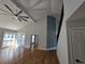 Bright living room features hardwood floors, ceiling fan, and french doors to the outside at 1960 Calvin Dr, Duluth, GA 30097