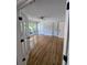 Spacious, sunlit living room features hardwood floors and access to the backyard at 1960 Calvin Dr, Duluth, GA 30097