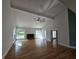 Spacious living room featuring hardwood floors, a fireplace, and large windows, offering a cozy and bright atmosphere at 1960 Calvin Dr, Duluth, GA 30097