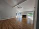 Spacious living room features hardwood floors, fireplace, modern ceiling fan, and natural light at 1960 Calvin Dr, Duluth, GA 30097