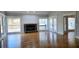 Spacious living room with stone fireplace, hardwood floors, and access to the outdoor deck at 1960 Calvin Dr, Duluth, GA 30097
