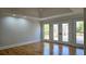 Spacious main bedroom with tray ceilings and access to the outdoor deck at 1960 Calvin Dr, Duluth, GA 30097