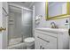 Updated bathroom featuring modern vanity, stylish mirror, and glass-enclosed shower at 7130 Spalding Ne Ct, Atlanta, GA 30328