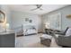 A bright Bedroom featuring a crib, bookshelf and a window with plantation shutters at 7130 Spalding Ne Ct, Atlanta, GA 30328