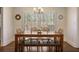 Charming dining area with a wooden table, bench seating, and bright window at 7130 Spalding Ne Ct, Atlanta, GA 30328
