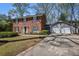 Beautiful brick two-story home with a two-car garage and basketball hoop at 7130 Spalding Ne Ct, Atlanta, GA 30328
