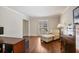 Comfortable living room with hardwood floors, shutters, and ample natural light at 7130 Spalding Ne Ct, Atlanta, GA 30328